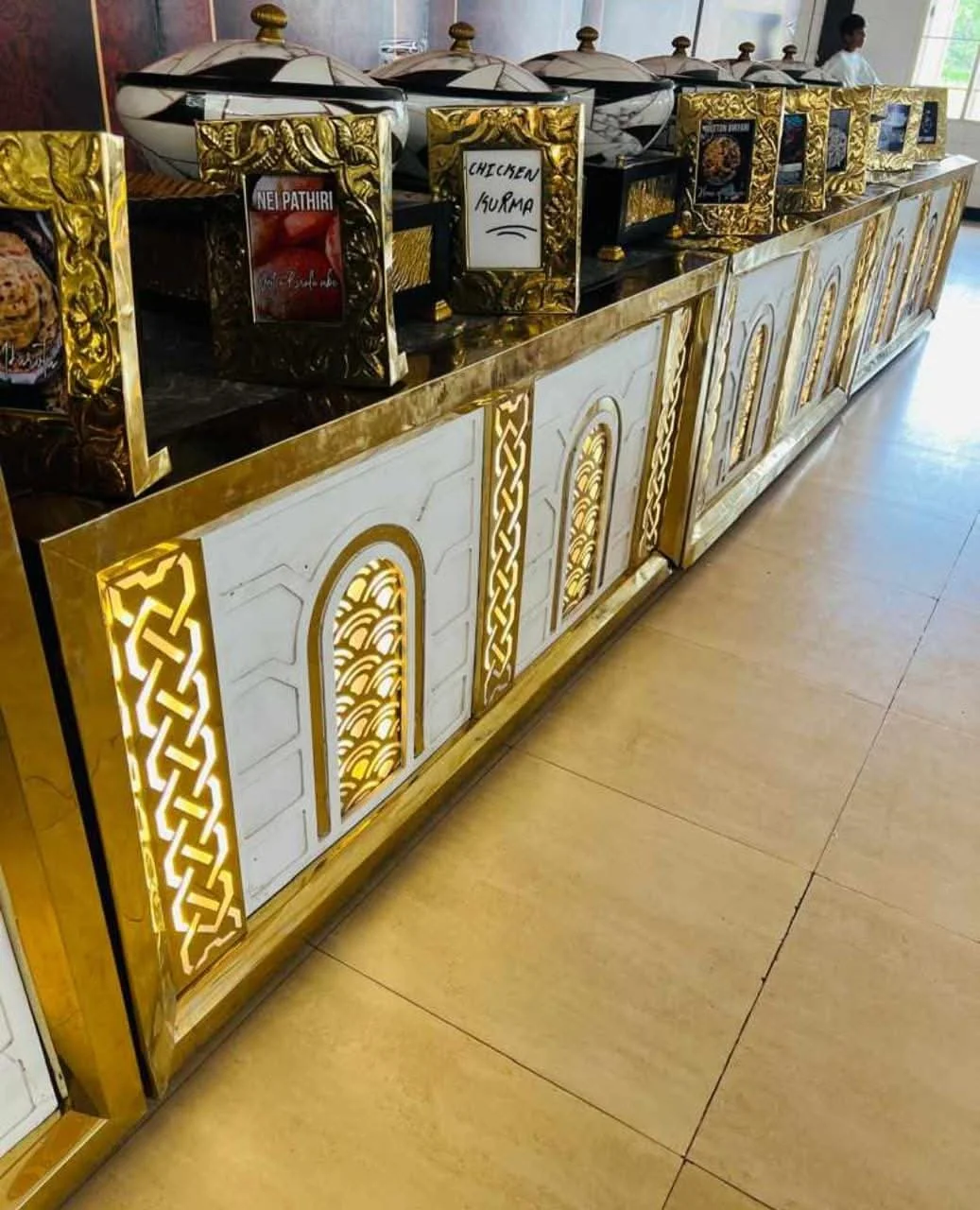 Golden decorated buffet counter from Shree Shabari Caterers