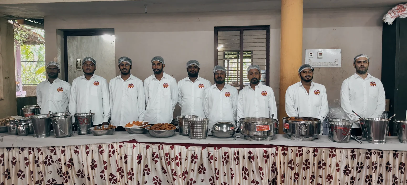 Shree Shabari catering staff behind their food service station